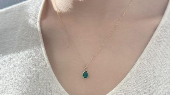 green crystal and gold necklace